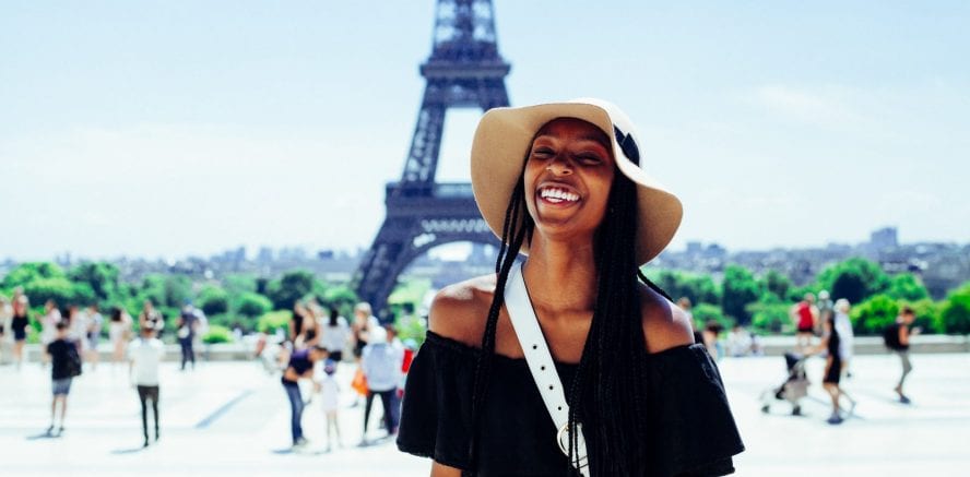 woman standing outside Eiffel tower