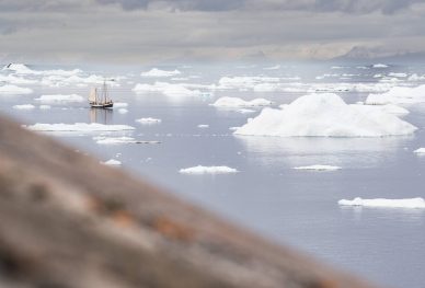 The Northwest Passage! A tall ship looks tiny agains the ice floes