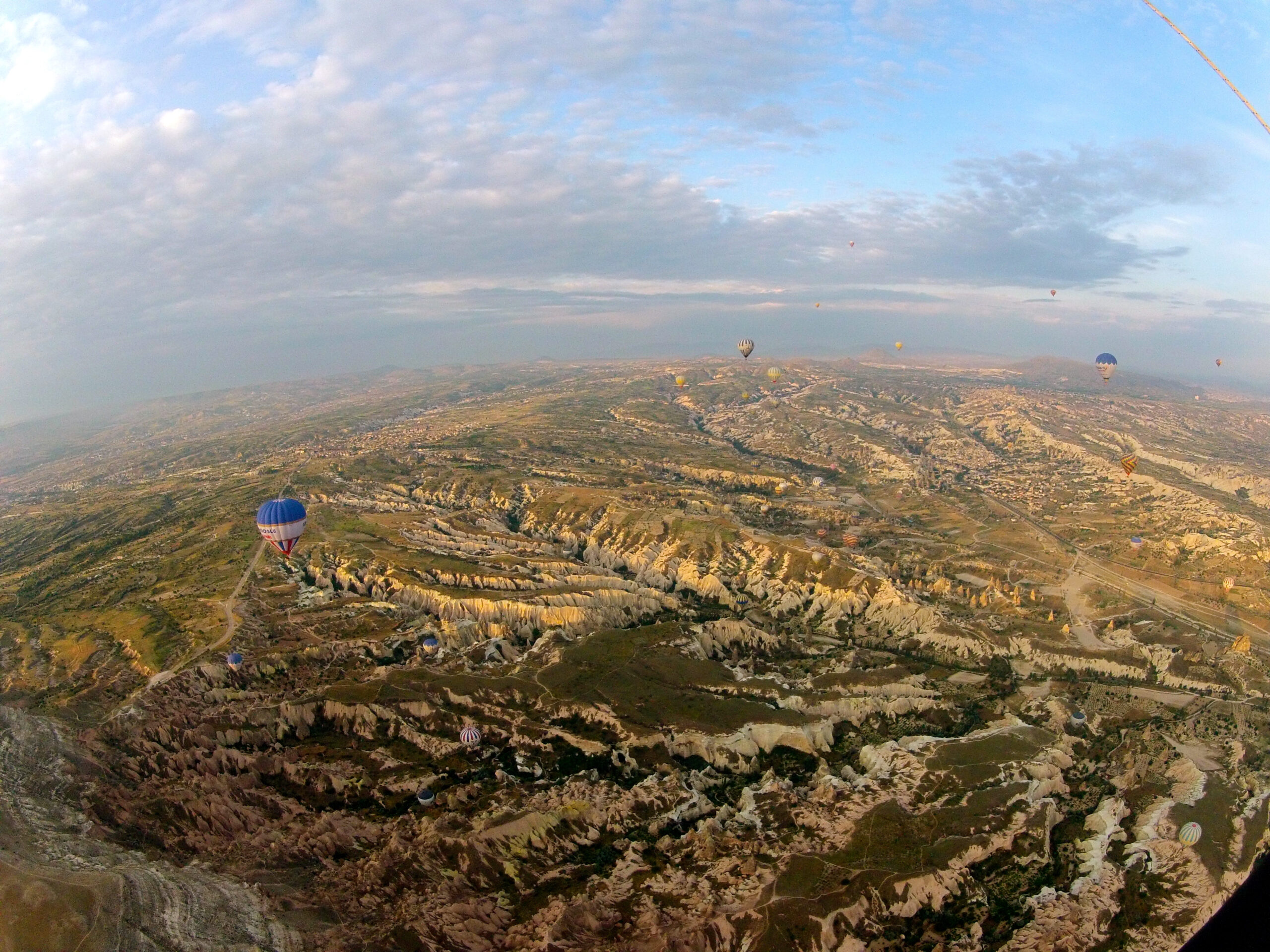 a shot of Turkey from a hot air balloon looking down at other balloons